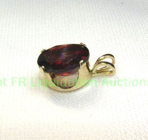 lot 130 image: 14K white gold Garnet pendant. Marked 14K. Approx 2.5 carats.