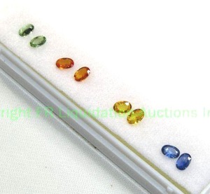 lot 133 image: Set of 4 color treated Sapphires. Matched pairs for earrings.