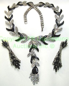 lot 135 image: Black enamel and diamond simulant vintage necklace.  16L w a 4 drop pendant. Garnet glass marquise (navette) shape prong set and diamond simulant poststud earrings