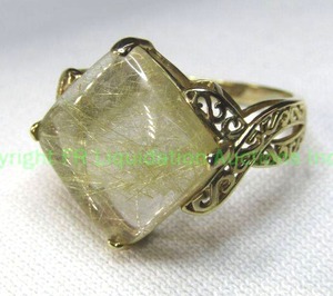 lot 144 image: 10K yellow gold prong set Golden Hair Rutilated Quartz ring. Marked 10K. Size 7.5