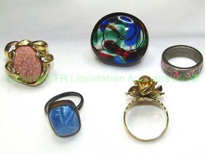 lot 145 image: (5) Rings. Includes (2) glass rings (one blue vintage), (2) gold stone and enamel flower. Metal rings may be sterling but unmarked.