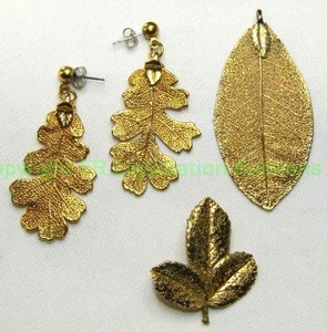 lot 148 image: (3) 24K gold dipped Hawaiian Maile Leaf demi parure set. Includes a pendant, poststud earrings and pin.