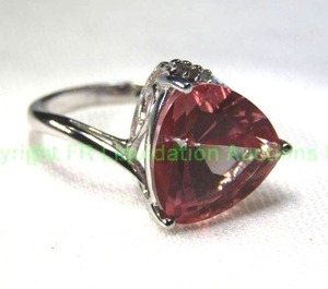 lot 149 image: 10K white gold Pink Topaz and diamond ring featuring a trillion cut Topaz (about 11 x 11mm) Size 7