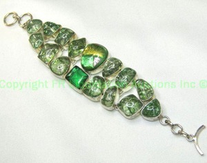 lot 236 image: Sterling silver dichroic glass and green quartz green crackle quartz bracelet. Marked 925. 7.5L