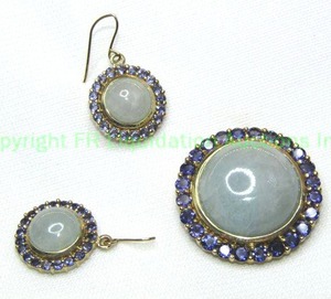 lot 329 image: 10K yellow gold Jade and Tanzanite pendant and French ear wire earring set. All pieces marked 10K. Jade and Tanzanite tested.