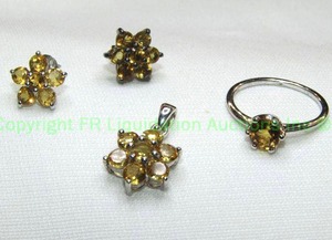 lot 331 image: Sterling silver Citrine jewelry suite in flower form. Includes ring (size 7.25), poststud earrings and pendant. All marked 925 RC.