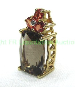 lot 334 image: 10K yellow gold Smoky Quartz, Red Quartz and Diamond pendant. Marked 10K THL.