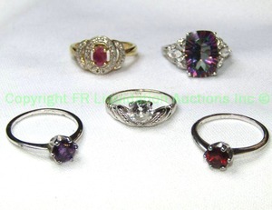 lot 346 image: (5) Sterling silver rings. Includes a Watermelon Topaz (Tested, Size 7.25), Garnet solitaire (Size 7.25), Amethyst solitaire (Size 7.25), White Quartz (Size 7.25) and vermeil Ruby ring (tested, Size 8). All marked 925.