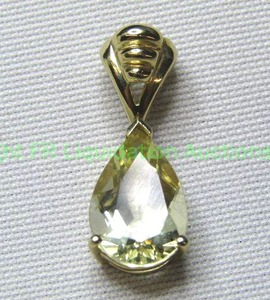 lot 349 image: 10K yellow gold Yellow Quartz Touramline Slide pendant with bale. Marked 10K