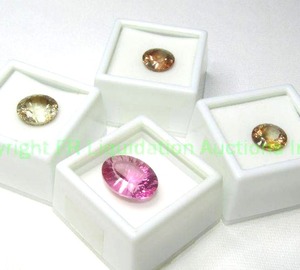 lot 352 image: (4) Topaz gems. Includes (3) Whisky Topaz and an oval treated Topaz.