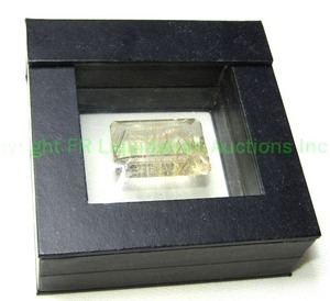 lot 355 image: Extra large golden rutilated quartz 1L x .75W in magnetic storage box.