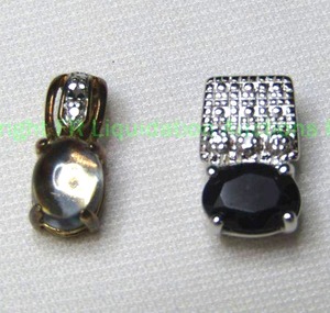 lot 356 image: (2) Sterling silver gemstone pendants. Includes a blue Sapphire and diamond and a Blue Topaz and diamond. Both marked 925
