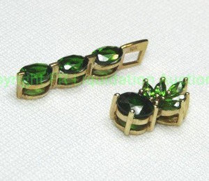 lot 359 image: (2) 10K yellow gold and green gemstone (probably Russian Diopside) pendants. Both marked 10K.