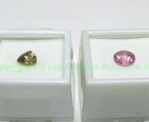 lot 385 image: (2) Simulant gemstones. (1) Pink YAG 10mm 4.50 carat, (1) 3.00 carat Strontium Titanate simulant 9x9mm