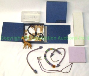 lot 423 image: Wood giraffe and bead necklace in JTV box. Broken, needs attention. Also includes an additional empty JTV box, other jewelry boxes.