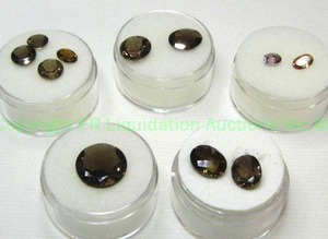 lot 401 image: (5) Garnet purple gemstones. One parcel is 10.00 carats of Spessartite Garnets. Varying sizes and quantities.
