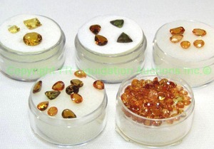 lot 402 image: (5) Yellow  Orange gemstones. Varying sizes and quantities.