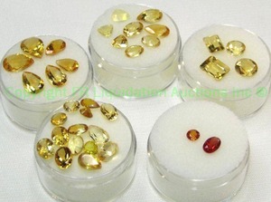 lot 405 image: (5) Yellow  Orange gemstones. Varying sizes and quantities.