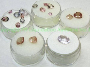 lot 406 image: (5) Pink Purple gemstones. Varying sizes and quantities.