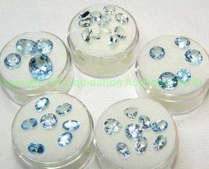 lot 412 image: (5) Topaz  Blue gemstones. Varying sizes and quantities.