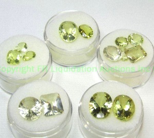 lot 414 image: (5) Yellow  Green gemstones. Varying sizes and quantities.