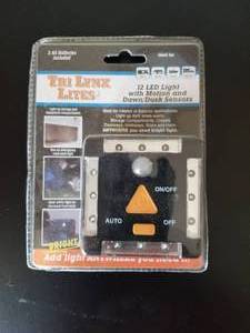 lot 191 image: LYNX 12-LED LIGHT WITH MOTION AND DAWNDUSK SENSORS  BLACK- #00027B