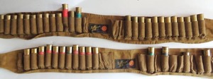 lot 21 image: Ammo belts with 12 gauge shells ( 1 has 25 shells and 1 has 15 magnum shots -00)