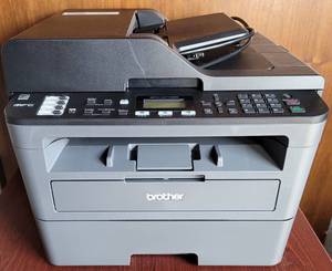 lot 15 image: BROTHER MFC-L2710DW LASER MULTI-FUNCTION PRINTER FAX, SCAN, COPY AS SHOWN. SEARCH IT UP