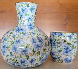 lot 72 image: AINSLEY (CHINTZ PATTERN) BLUE & WHITE ALL OVER FLORAL CERAMIC WATER CARAFE AND CUP.