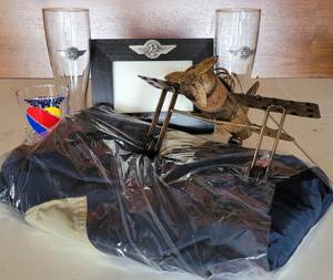 lot 95 image: SOUTHWEST AIRLINES BRANDED COLLECTION INCLUDING WIND BREAKER (SM) AND RETRO SOLID OAK AND BRASS PROP PLANE