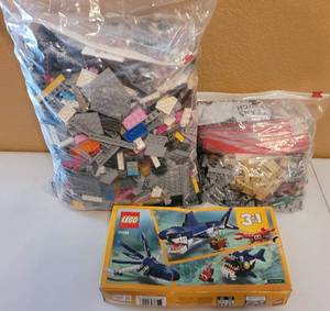 lot 201 image: LEGO GROUP. INCLUDES 7.7 LBS OF FUN-FILLED LOOSE LEGOS AND LEGO CREATOR 3 IN 1 DEEP SEA CREATURE KIT