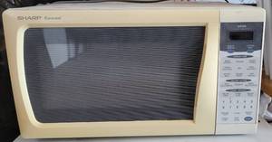 lot 161 image: SHARP MICROWAVE OVEN MODEL R-319FW AS SHOWN.