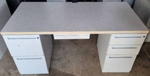 lot 145 image: OFFICE DESK WITH 5 ASSORTED SIZE DRAWERS INCLUDING 2-FILING DRAWERS AS SHOWN. CONDITION MAY VARY. PLEASE NOTE THESE WILL BE DISTRIBUTED ON A FIRST COME FIRST SERVED BASIS.