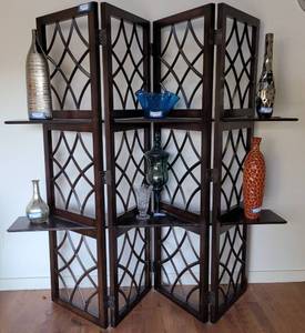 lot 3 image: 4 PANEL WOODEN ROOM DIVIDER  SCREEN WITH SHELVES IN STYLE, COLOR, AND CONDITION SHOWN. CONTENTS NOT INCLUDED APPROX. 66 W x 17 D x 72 H.