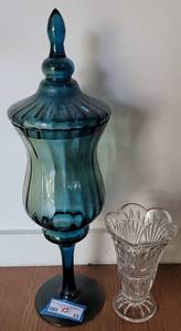 lot 13 image: (1) DECORATIVE FOOTED GLASS VASE WITH LID AND (1) CRYSTAL VASE AS SHOWN. (1) 21 H x 6 34 W AND (1) 8 H x 5 W. (SOLD 2X THE MONEY)