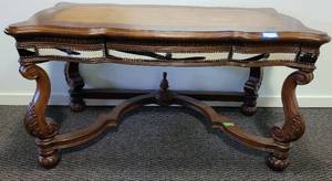 lot 57 image: WOODEN TABLE WITH LEATHER INLAY TOP AND COWHIDE ACCENTS IN STYLE, COLOR, AND CONDITION SHOWN. TAKE A LOOK APPROX. 60 W x 32 D x 33 H.