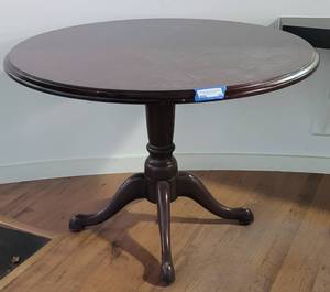 lot 69 image: ROUND WOODEN OFFICE TABLE IN STYLE, COLOR, AND CONDITION SHOWN. APPROX. 42 Dia. x 29 12 H.