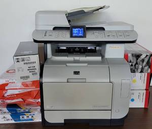lot 122 image: HP COLOR LASERJET CM2320NF MFP PRINTER WITH EXTRA SUPPLIES AS SHOWN.