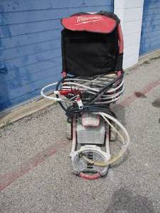 lot 61 image: Milwaukee # M4910-21, Electric Airless  Finish Paint Sprayer With Bag, Hoses and Operators Manual.... Works
