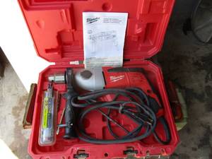 lot 130 image: Milwaukee -110V, 12 Electric Hammer Drill With Handle, Chuck Key, Bits,  Operators Manual And Caring Case.