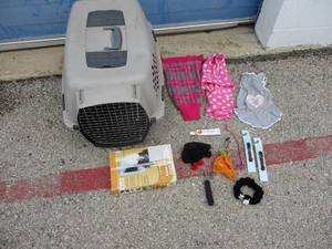 lot 23 image: PET LOT- Including Unused Small Doggie Door, Pet Carrier, Clothing, Collars And Misc.