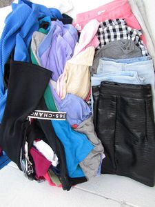 lot 94 image: Assorted shirts and pants, including Zara, Ostradivarius, and more