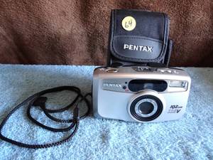 lot 64 image: Pentax IQZoom 115V Point and Shoot Film Camera With Brand Camera Bag
