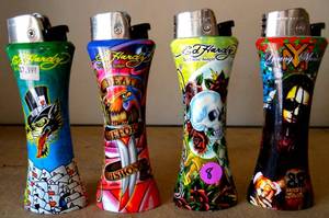 lot 8 image: ED HARDY JUMBO CURVE Refillable LIGHTERS - COLLECTION OF 4 - WITH BOTTLE OPENER