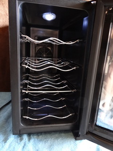 lot 202 image: Oster 12 Bottle Wine Cellar (MODEL OW0912H6H) - LIGHTED CABINET UNUSED - TESTEDWORKING