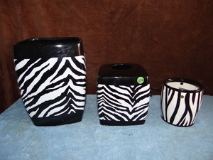 lot 272 image: NICE ZEBRA THEMED BATHROOM COLLECTION - WASTE BASKET, TISSUE DISPENSER, & CANDLE