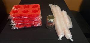 lot 258 image: Lot of Makers Mark Disposable Plastic Shot Glasses, Silicone Ice Cube Trays, and Jar