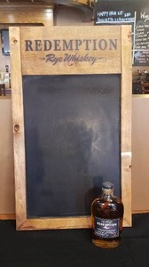 lot 268 image: Redemption Rye Whiskey Chalkboard Sign with Bottle SEE DESCRIPTION