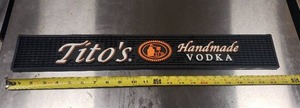 lot 56 image: Titos Vodka 22.5 Bar Mat
