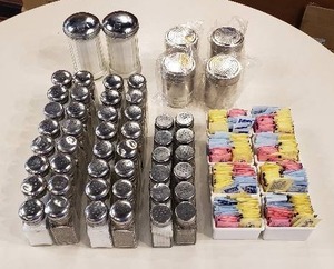 lot 101 image: Lot of 22 Sets of Salt & Pepper Shakers, 2 Sugar Shakers, 4 Stainless Steel Dredgers, and 8 Sugar Packet Holders